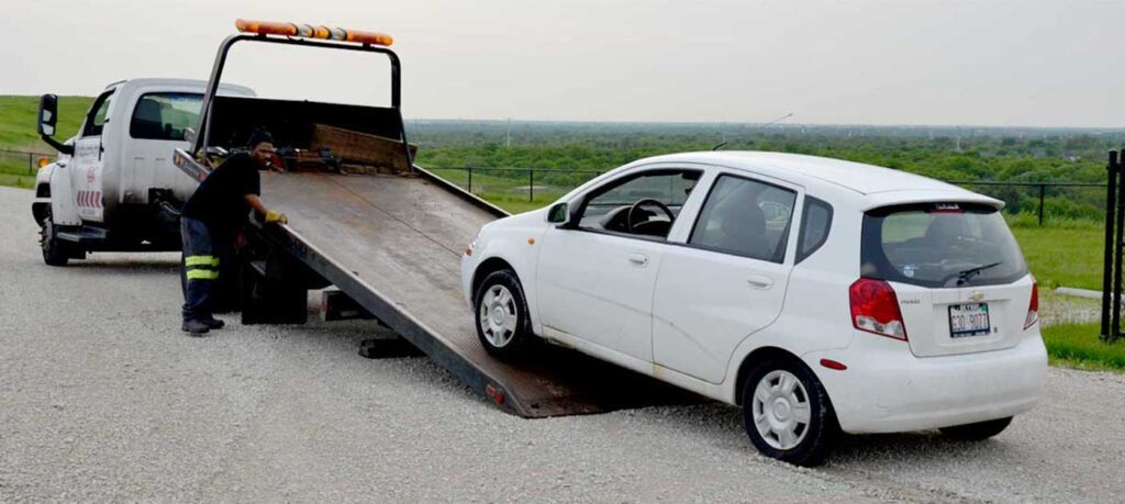 tow truck in indianapolis towing a white sedan