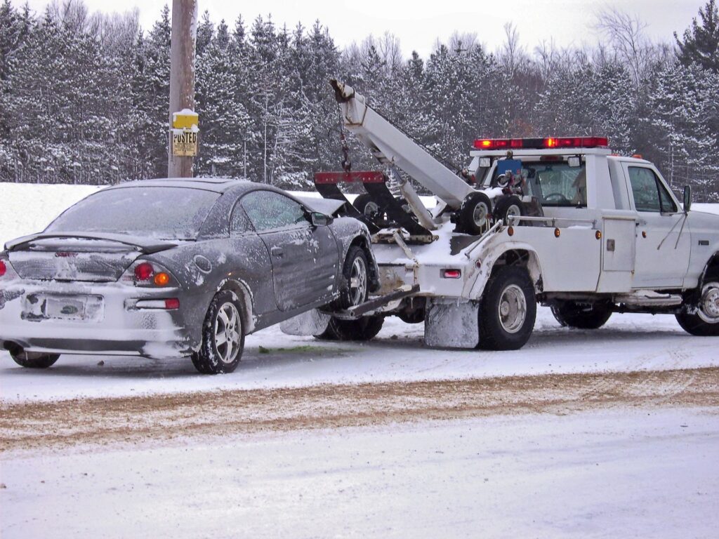 trusted towing company towing a car